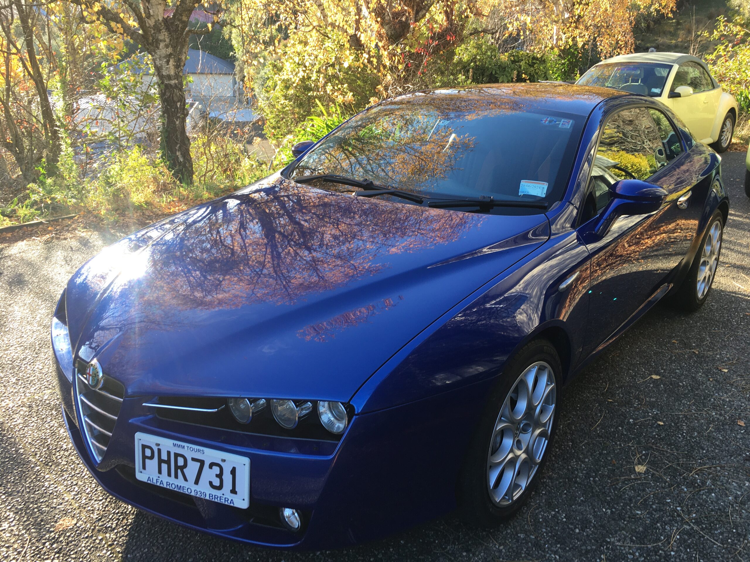 Alfa Romeo Brera front three quarters shot in sunshine under trees